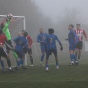 Vics trouble the Andover keeper in the Beatrice Avenue fog last Saturday