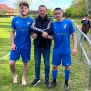 Vics players Raff Boyd-Kerr, left and Toby Snow with travelling fan Russ Chapman.