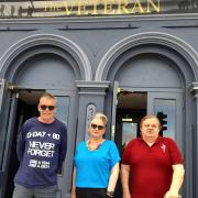Dale Hillier, Fiona Gwinnett and veteran Wayne Wright, outside The Veteran bar and hotel for homeless veterans in Ryde.