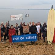 Surfers Against Sewage members protest at Gurnard Beach
