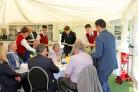 IW College hospitality students working at the cricket club. Students serving.