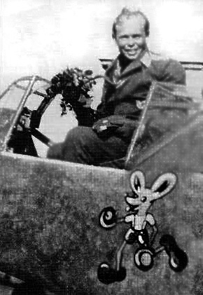 The very plane that Horst Hellriegel landed on Bowcombe Down. On the side is Mickey Mouse in boxing gloves and in the cockpit is Horst Jaenisch, the regular pilot of the 109. Picture by Alan Stroud.