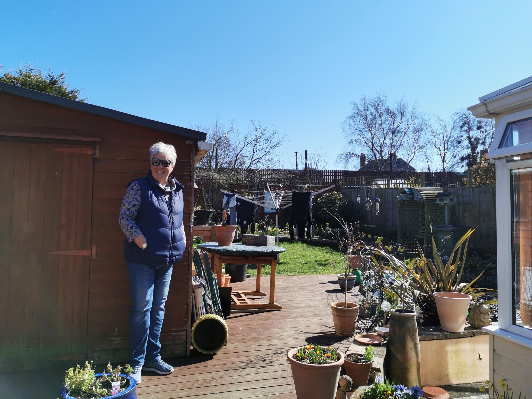 Diane Holbrook in her garden. People standing on the platform can see right into her garden and home.