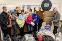 Volunteers sorting donations to send to Ukraine.