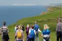 Walking the Isle of Wight's coast to Tennyson Down in the distance.