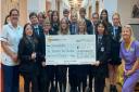 Students and staff during the cheque presentation.