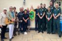 The team from The Three Bishops at Brighstone celebrate the arrival of their new life saving public access defibrillator alongside colleagues from the Isle of Wight Ambulance Service.