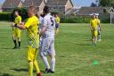 Isle of Wight Man v Fat in action at Bembridge's Steyne Park, wearing yellow, earlier this year