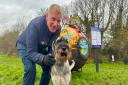 Dog walker Glyn Jenkins and his three-year-old Schnauzer, Rusty, at the Honesty Pay and Display near Carisbrooke Castle