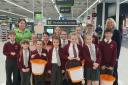 Clare Jones, Asda community champion, Y5 students and Mrs M Young.