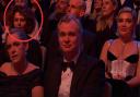 Donna Langley, sat behind Emma Thomas and Christopher Nolan.