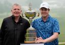 Scotland’s Robert MacIntyre, right, and his father and caddie, Dougie MacIntyre pose for photos with the trophy after winning the RBC Canadian Open (Frank Gunn/The Canadian Press via AP)