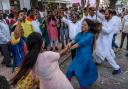 Congress Party supporters celebrate during the counting of votes (Rafiq Maqbool/AP)