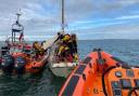 Cowes lifeboat stands off as crew members of both Cowes and Calshot lifeboats go aboard the 40-foot yacht on Saturday, to provide assistance.