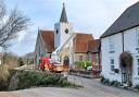 Firefighters at Newchurch making the spire of the parish church safe following damage caused by Storm Eunice.