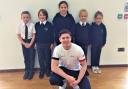 British world champion gymnast Jaydon Paddock with pupils  at St Francis Primary School, Ventnor.