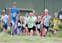 Youngsters sprint off in the junior Duver Dash to mark the beginning of this year's Isle of Wight Festival of Running.