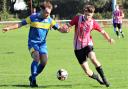 Toby Snow, right, was on target for East Cowes Vics at high-flying Downton.  Photos: Graham Brown