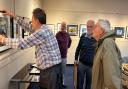 The Isle of Wight Photographic Society exhibition being hung.