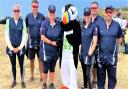 The clay shooting team with Jet the Puffin, the Island Games mascot..