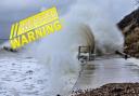 Waves crash against the seawall in Totland. A warning is in force today.