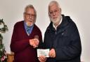 Ron Wallis of the IW VMCC presenting a cheque to Roger Dennis of the IW Prostate Cancer Support Group