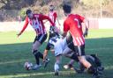 Harrison Yates comes away with the ball in a hard-fought match for Vics last Saturday
