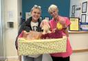 Macie Edkins-Wherry delivering Easter treats to Solent Grange's Ali French