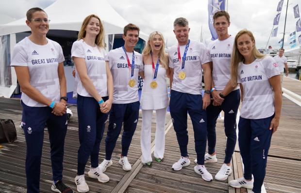 Isle of Wight County Press: Georgia Toffolo (middle) poses for a photograph alongside alongside British Olympic Sailing Team Athletes