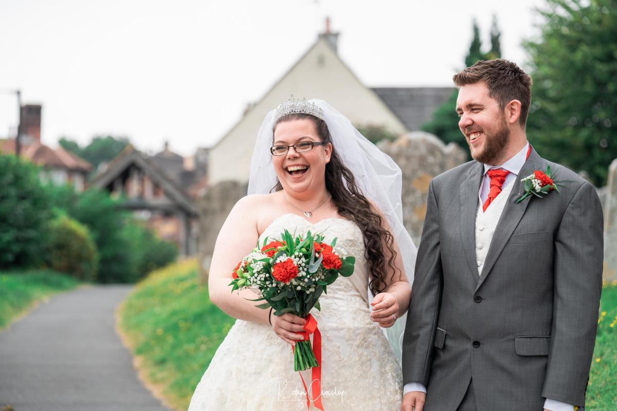 Stephanie Manfield and Daniel Hall gathered outside the church. Picture by Robin Crossley Photographer.