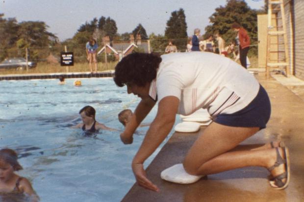 Isle of Wight County Press: Shirley Miles teaching children in the pool before it had a roof (and before Brookside Health Centre was built). Picture courtesy of West Wight Sports and Community Centre.