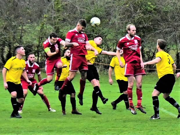 Isle of Wight County Press: W&B co-manager scoring a bullet header in their match against Sandown & Lake which they won 5-0 to claim a 30th Island League win on the trot. Photo: Mathew Wells 
