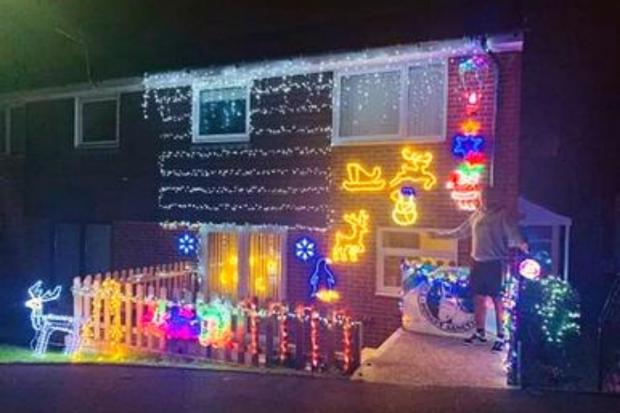 Isle of Wight County Press: Luke with his Christmas lights. Picture courtesy of Luke Lusted.