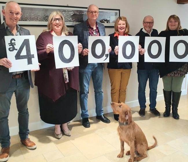 Wightaid trustees, from left: Geoff Underwood, Claire John, Steve Porter, Sue Lucas, Brian Marriott and Rachael Randall, with Mavis the dog.