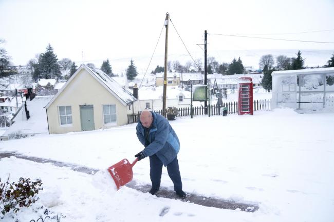 Man shovels snow