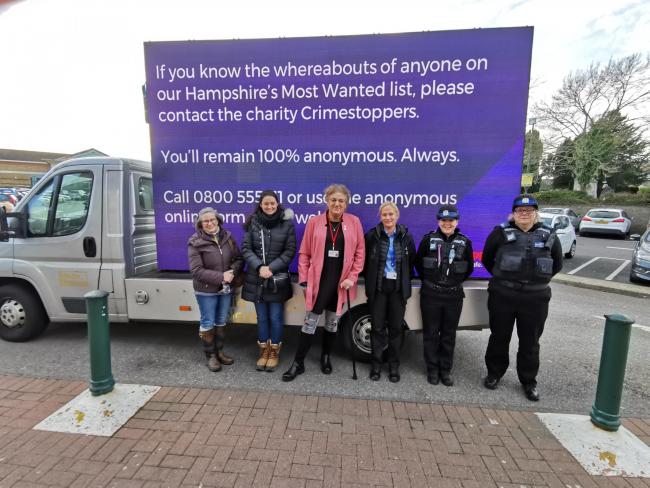 Crimestoppers volunteers and police outside Morrisons, Newport.
