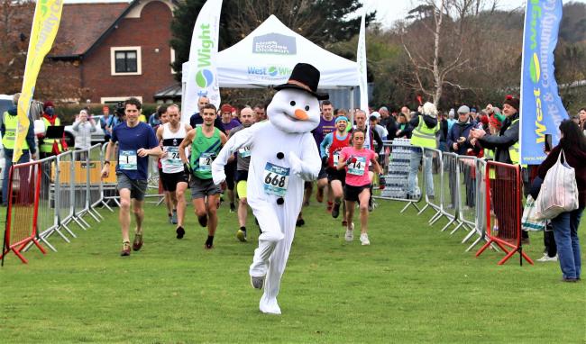 A speedy snowman sets an early pace at the start of the 2021 Chilly Hilly at the West Wight Sports and Community Centre, Freshwater.  Pictures by Paul Blackley