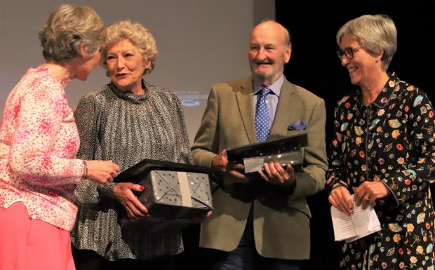 Isle of Wight County Press: Gillian Burnett and Robin Courage, centre, both receiving the the Trustees' Award for Outstanding Commitment to Sport.
