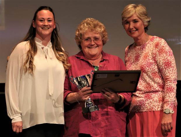 Isle of Wight County Press: Ann Selby, centre, receiving the lifetime achievement accolade at the Isle of Wight Sports Achievement Awards. Photo: Paul Blackley