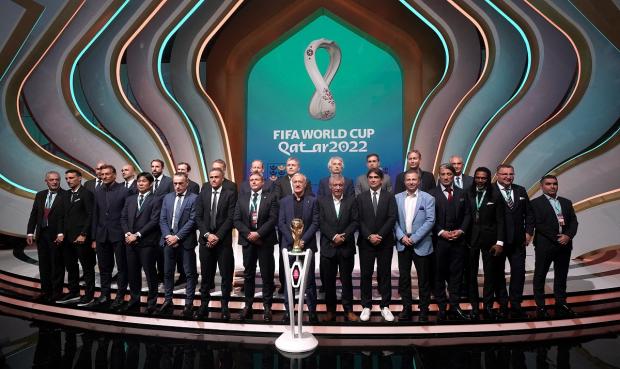 Isle of Wight County Press: Managers, including England manager Gareth Southgate (back row third left), on stage during the FIFA World Cup Qatar 2022 Draw. Picture: PA