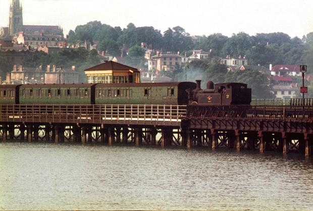 Isle of Wight County Press: A pleasantly full train makes its way down Ryde Pier, sometime in the 60s. (See gallery for full caption). Photo: Colin Fairweather/County Press. 