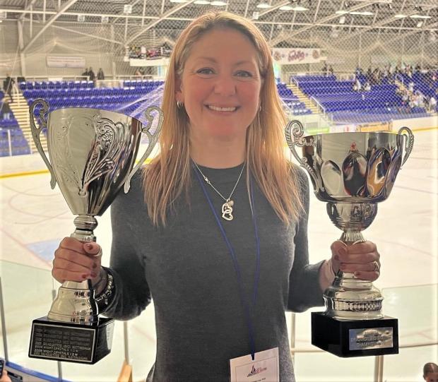 Isle of Wight County Press: Proud coach Terri Smith with the two national trrophies won by two of her teams in Sheffield.
