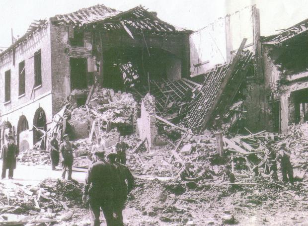 Isle of Wight County Press: The bombs fell heavily on Cowes too, destroying the George Hotel in Market Hill. Photo: IWCP Archive.