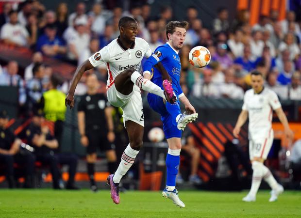 Isle of Wight County Press: Eintracht Frankfurt's Evan N'Dicka and Rangers' Scott Wright (right) battle for the ball during the UEFA Europa League Final at the Estadio Ramon Sanchez-Pizjuan, Seville. Credit: PA