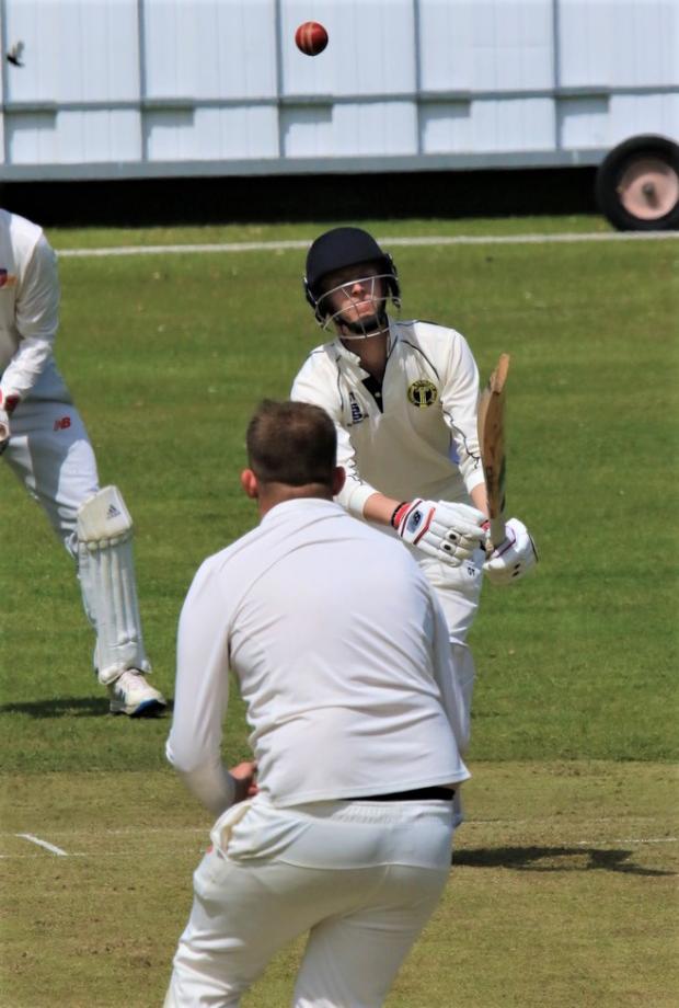 Isle of Wight County Press: Shanklin’s Harry Moore celebrates a caught and bowled with a dolly catch.