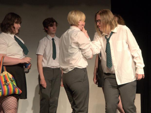 Isle of Wight County Press: Centre, Zak played by Ria Seager, being teased by bullies played by Lucas Raynor and Jess Rockhill, and Dale played by Harrison Hartup. Photo: Paul Jennings.