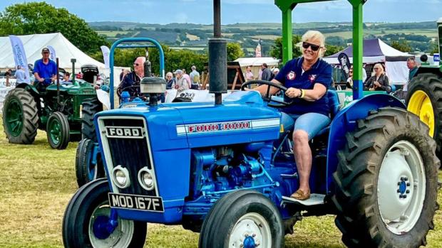 Isle of Wight County Press: Becky Kingswell from Stoney Cross Farm, near Calbourne drives a 1967 Ford 3000 tractor.