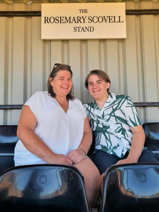 Isle of Wight County Press: Claire Apsey, Ray and Rosemary Scovell’s daughter and her son, Simon, in the newly-named Rosemary Scovell Stand. Photo: Jon Moreno
