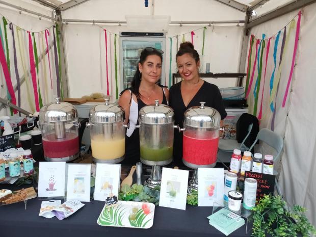 Isle of Wight County Press: Lauren Morton and Kate England, founders of Isle of Wight-based juice company, Elixir, which has a stand in Cowes Parade Village.