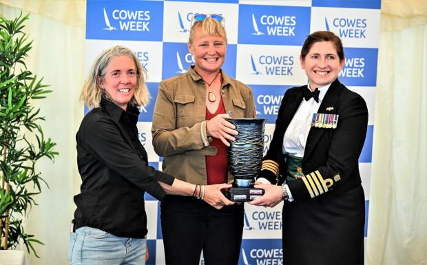 Isle of Wight County Press: Pip Hare, centre, holds the Women's Day Trophy at Cowes Week.  Photo: Martin Allen